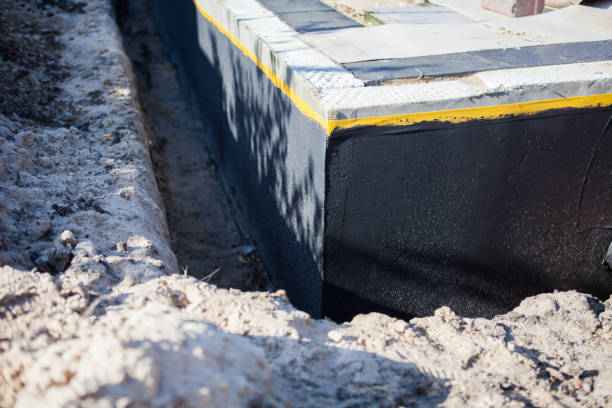 Professional Basement Waterproofing technician working in Sharpsburg, PA